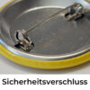 Der Sicherheitsverschluss des 37-mm Buttons ist mit einem drehbaren Riegel gesichert.
